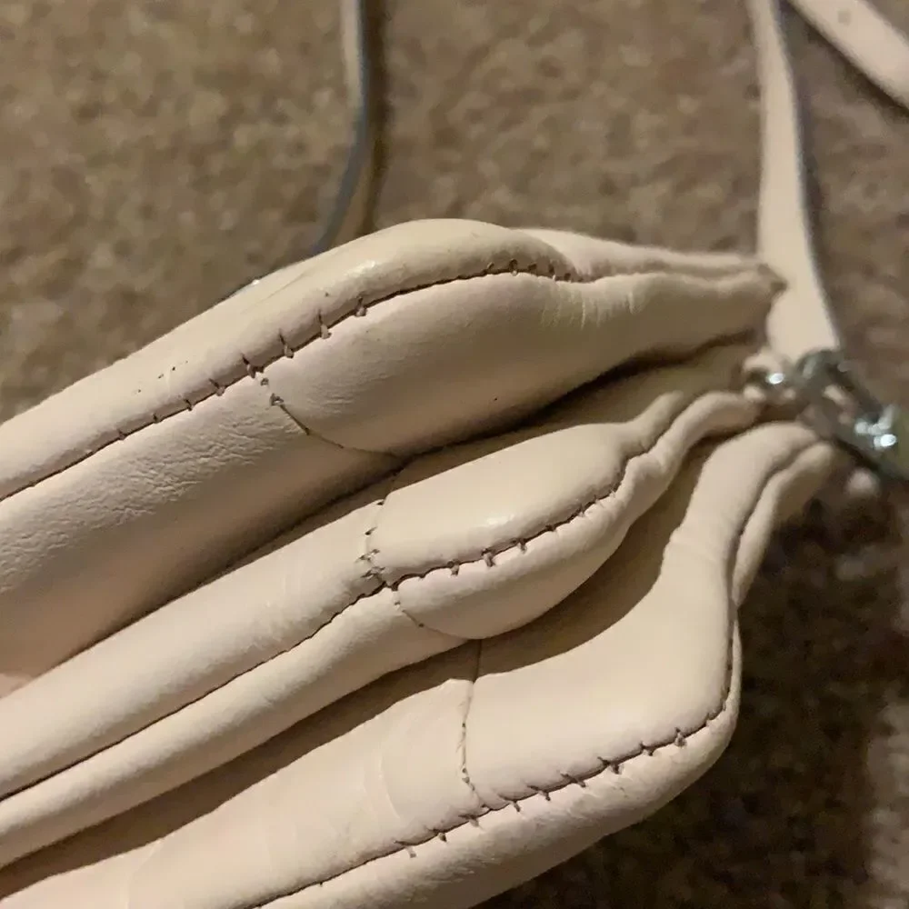 Vince Camuto soft pink crossbody wristlet.